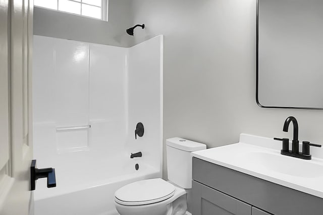 full bathroom featuring vanity, toilet, and shower / washtub combination