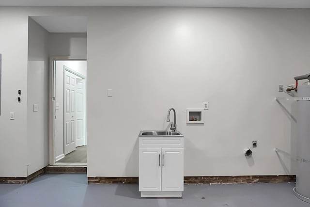 clothes washing area featuring cabinets, hookup for a washing machine, hookup for an electric dryer, and sink