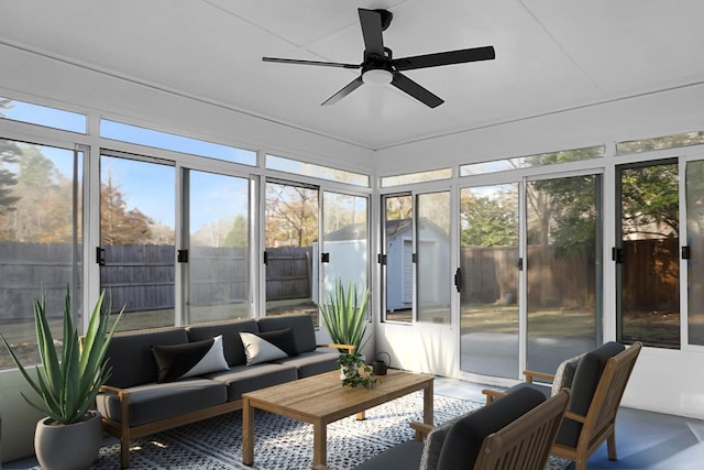 sunroom / solarium featuring ceiling fan and a wealth of natural light