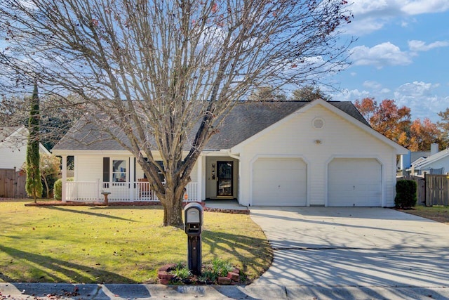 ranch-style house featuring covered porch, a garage, and a front yard