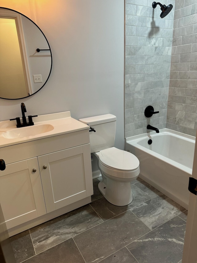 bathroom featuring vanity, washtub / shower combination, and toilet