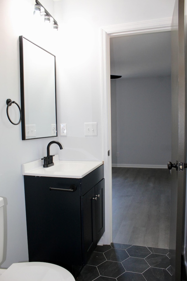half bath with vanity and toilet