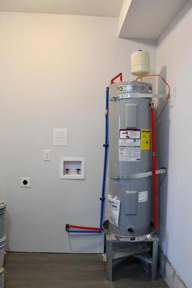 utility room with strapped water heater