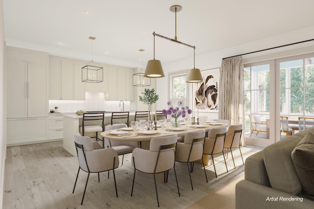 dining room with a healthy amount of sunlight, sink, and light wood-type flooring