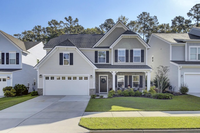 craftsman-style house featuring a porch, a garage, and a front lawn