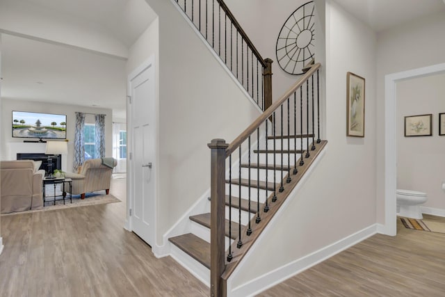 stairway featuring hardwood / wood-style flooring