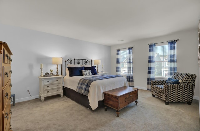 bedroom with light colored carpet