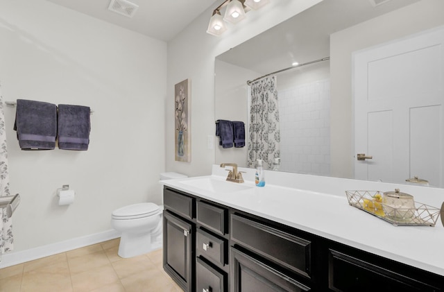 bathroom featuring tile patterned flooring, vanity, a shower with shower curtain, and toilet