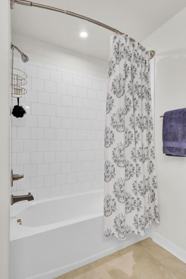 bathroom with shower / tub combo and tile patterned floors