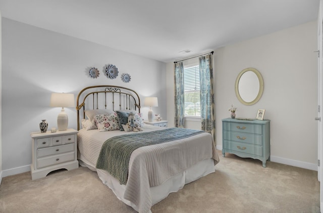 bedroom featuring light carpet