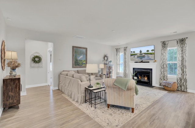 living room with light hardwood / wood-style flooring