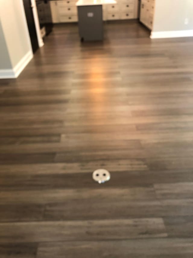 room details with baseboards and wood finished floors