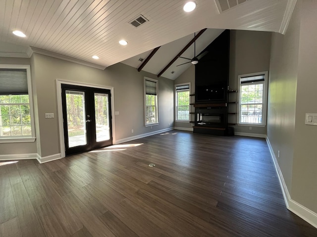 unfurnished living room featuring ceiling fan, visible vents, baseboards, lofted ceiling, and dark wood-style floors
