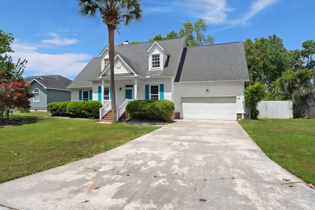 view of front facade featuring a porch, fence, driveway, and a front yard