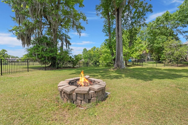 view of yard featuring a fenced backyard and an outdoor fire pit
