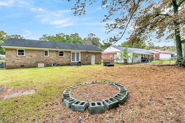 back of house featuring a yard