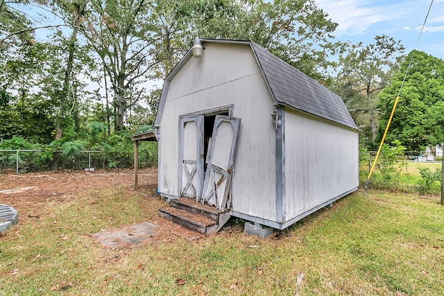 view of outbuilding with a lawn