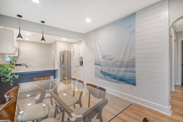 dining space featuring light hardwood / wood-style flooring