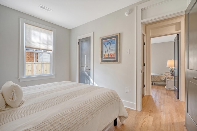 bedroom with light hardwood / wood-style floors