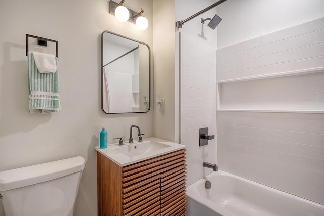 full bathroom with tiled shower / bath combo, vanity, and toilet