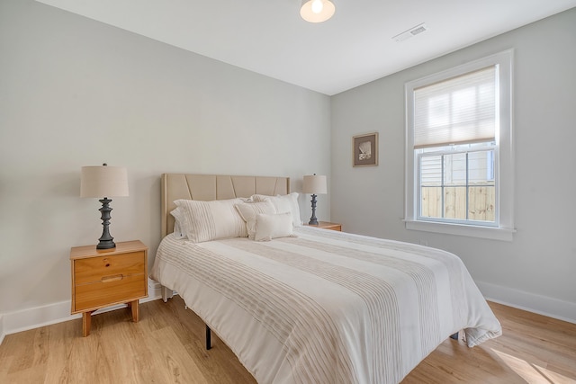 bedroom with light hardwood / wood-style floors