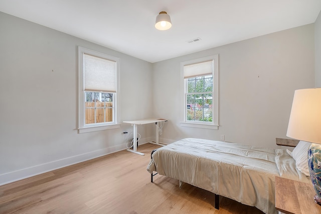 bedroom with light hardwood / wood-style floors