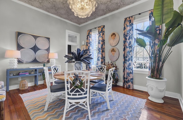 dining space with wood-type flooring and crown molding