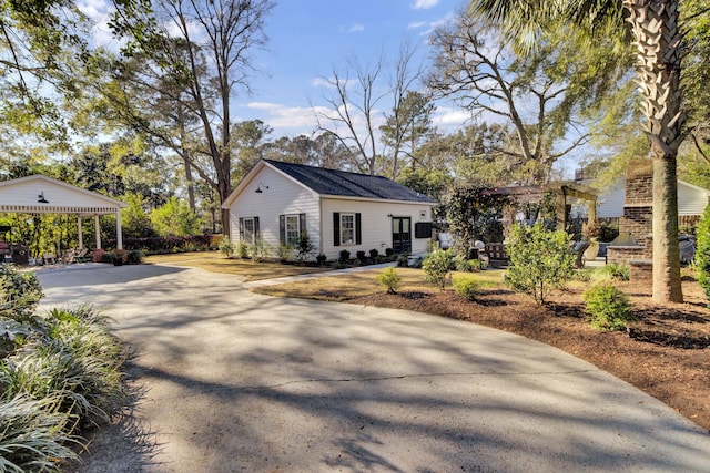 view of front of home with an outdoor fireplace