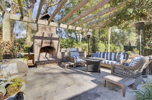 view of patio / terrace with an outdoor living space with a fireplace and a pergola