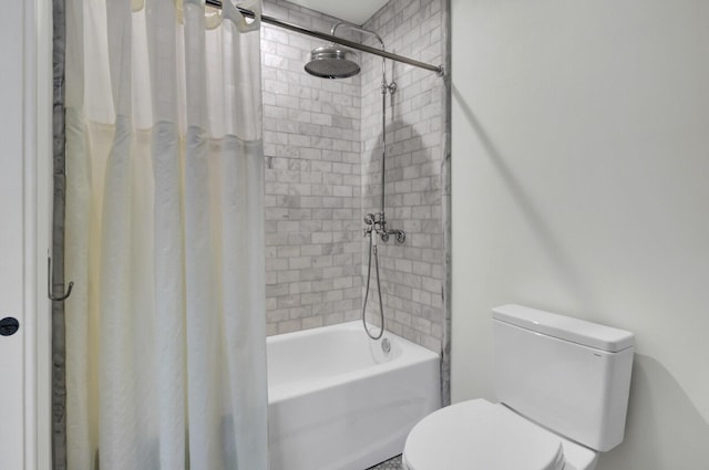 bathroom with shower / tub combo and toilet