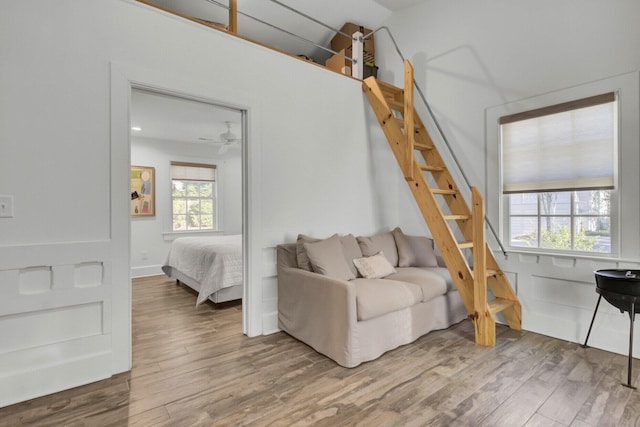 bedroom featuring hardwood / wood-style flooring and multiple windows