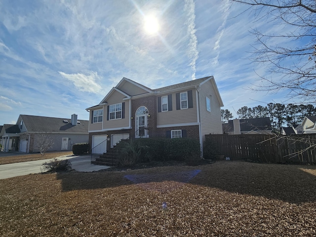 raised ranch featuring a garage