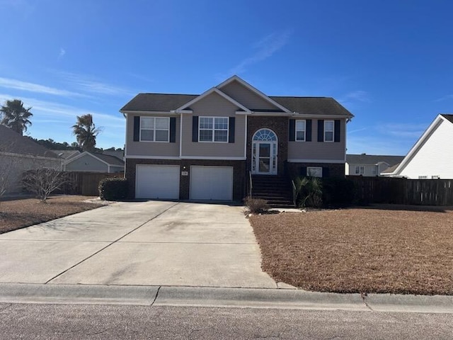 raised ranch featuring a garage