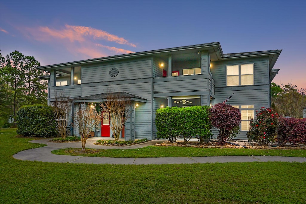 view of front of house with a yard