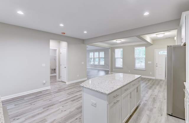 277 W Smith St, Lincolnville, SC 29485 - kitchen featuring freestanding refrigerator, open floor plan, light wood-style flooring, a kitchen island, and baseboards