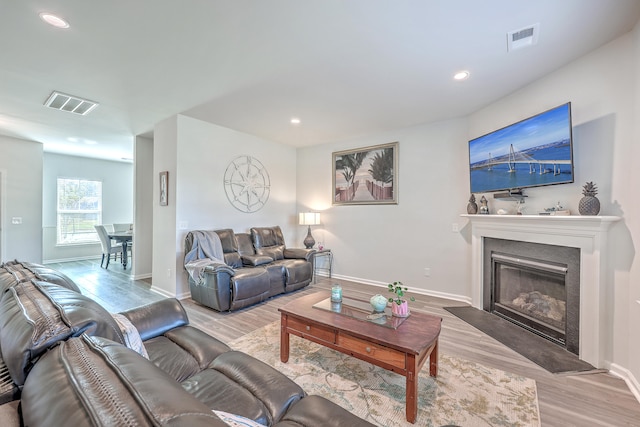 living room with light hardwood / wood-style floors