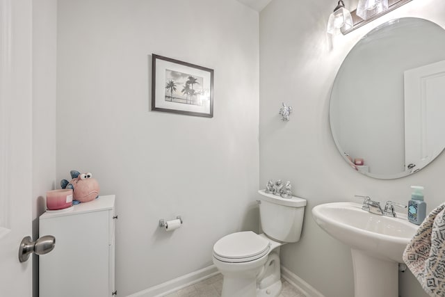 bathroom featuring tile patterned flooring and toilet