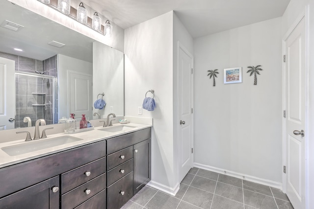 bathroom featuring vanity, tile patterned floors, and a shower with door