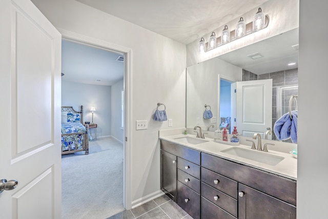 bathroom featuring tile patterned floors, vanity, and walk in shower