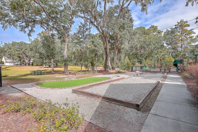 view of property's community featuring a yard