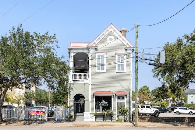 view of front of home with a balcony