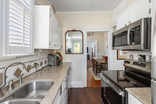 kitchen with white cabinets, stainless steel appliances, dark wood-type flooring, and sink