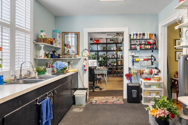 kitchen featuring sink and concrete flooring