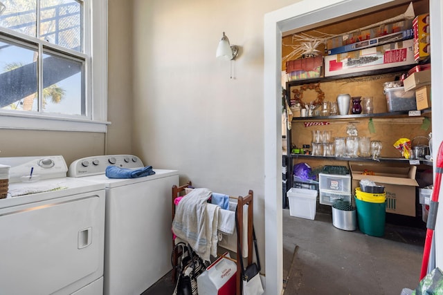 clothes washing area with independent washer and dryer