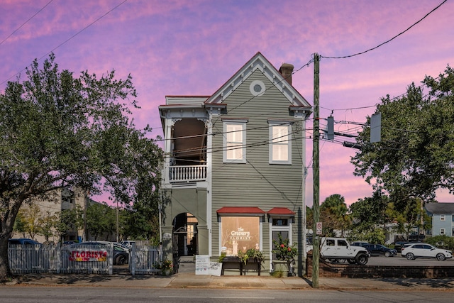 view of front of house with a balcony