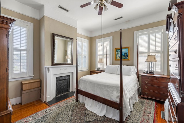 bedroom featuring ceiling fan and dark wood-type flooring