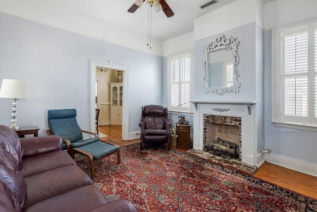 living room with wood-type flooring and a healthy amount of sunlight