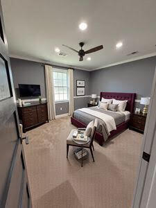 bedroom featuring recessed lighting, carpet, ornamental molding, and a ceiling fan