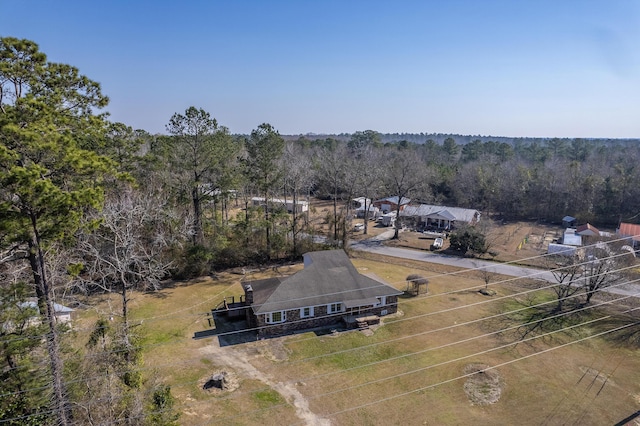 bird's eye view featuring a wooded view