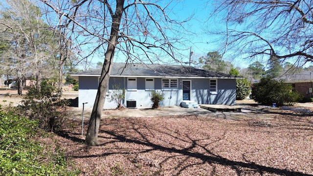 rear view of property with central AC and entry steps